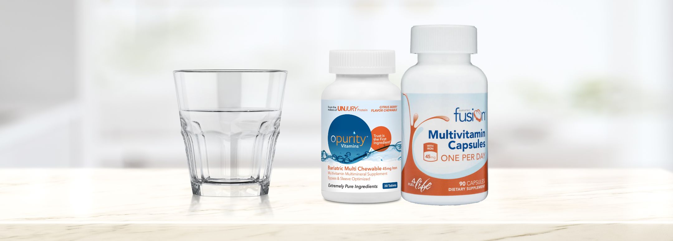 Unjury and Bariatric Fusion Vitamin Bottles with glass of water